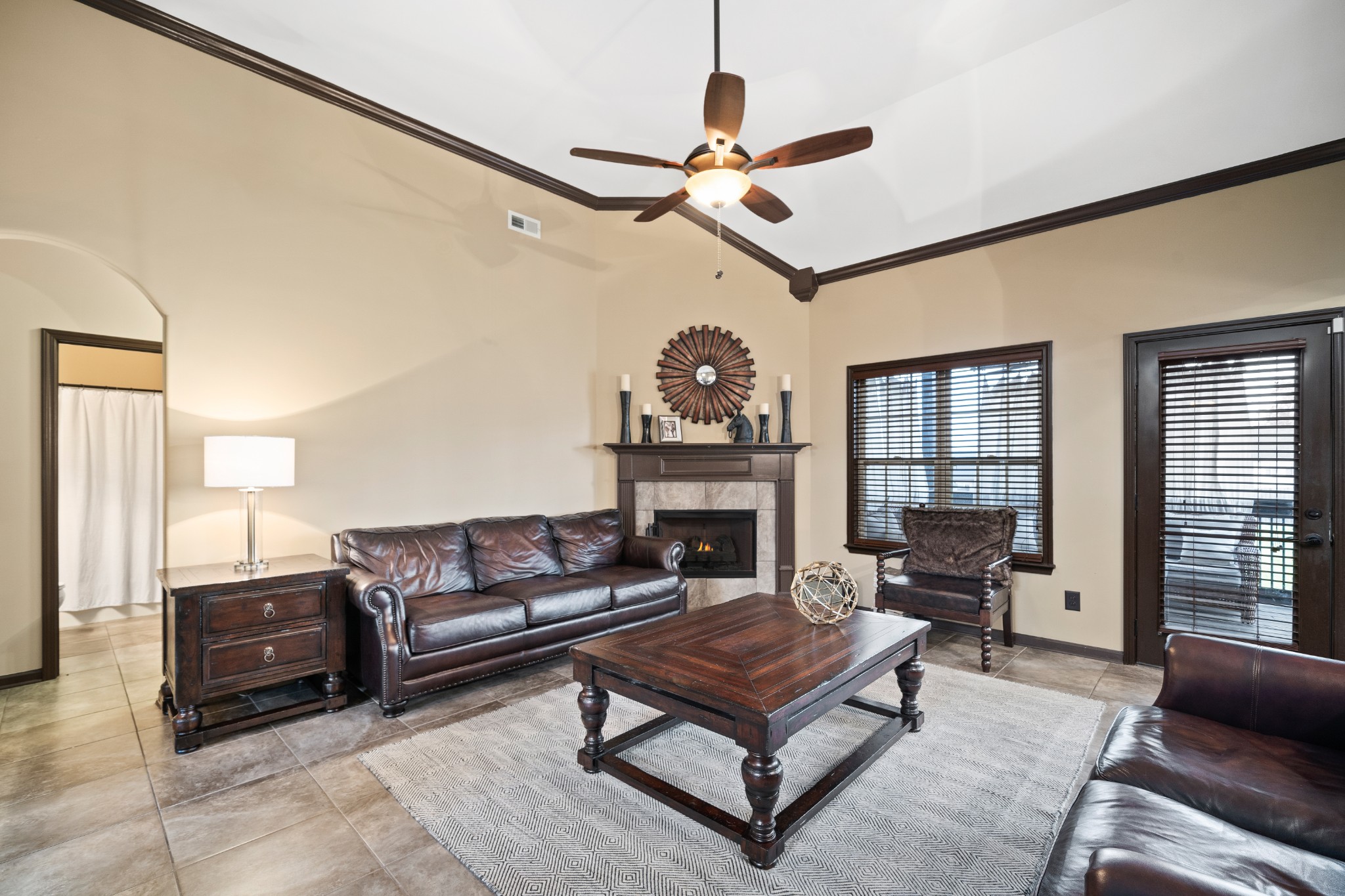 1439 Raven Road Clarksville, TN 37042 - Photo 6 of 28 a living room with furniture a chandelier and a fireplace