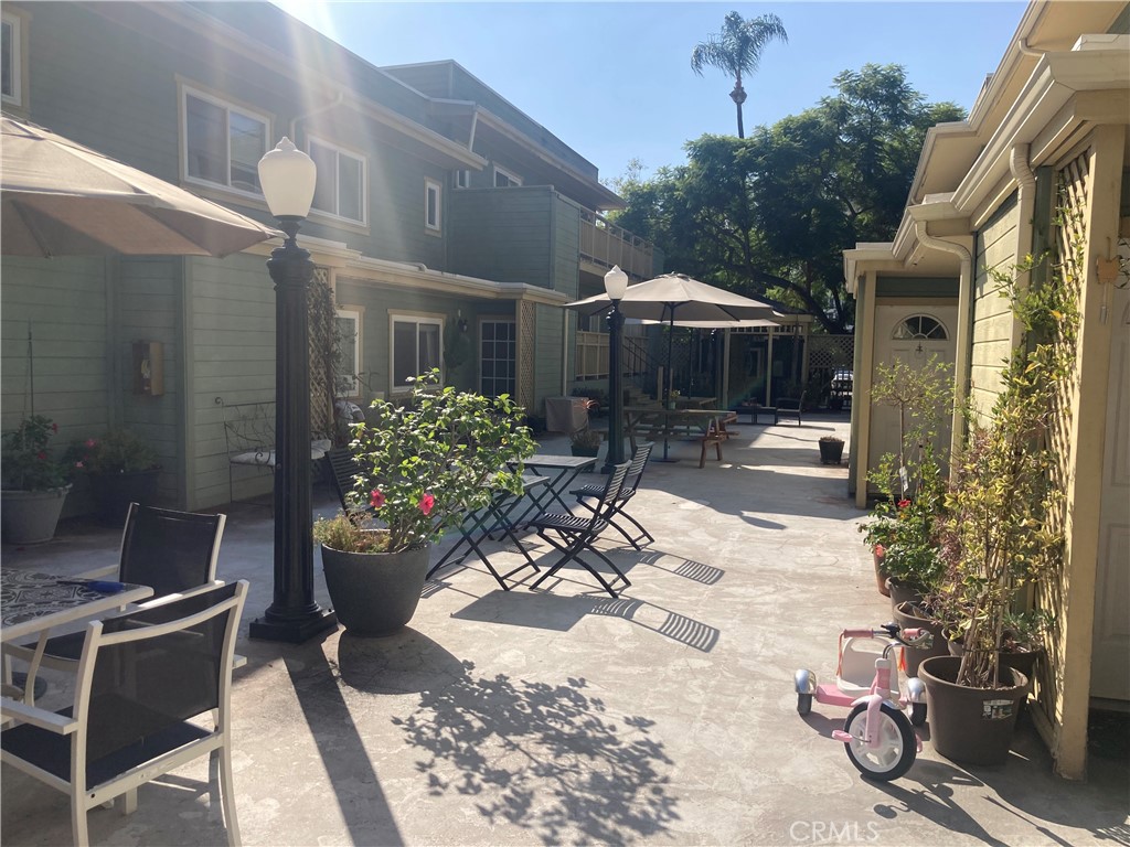 809 North Spurgeon Street, Unit 5 Santa Ana, CA 92701 - Photo 2 of 12 a view of a patio with table and chairs potted plants