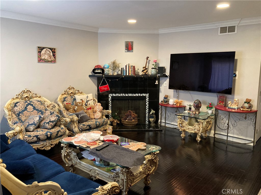809 North Spurgeon Street, Unit 5 Santa Ana, CA 92701 - Photo 4 of 12 a living room with furniture and a fireplace