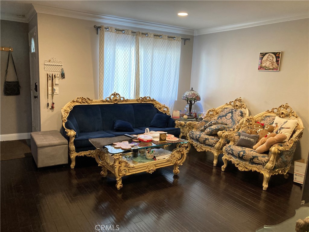 809 North Spurgeon Street, Unit 5 Santa Ana, CA 92701 - Photo 6 of 12 a living room with furniture and wooden floor