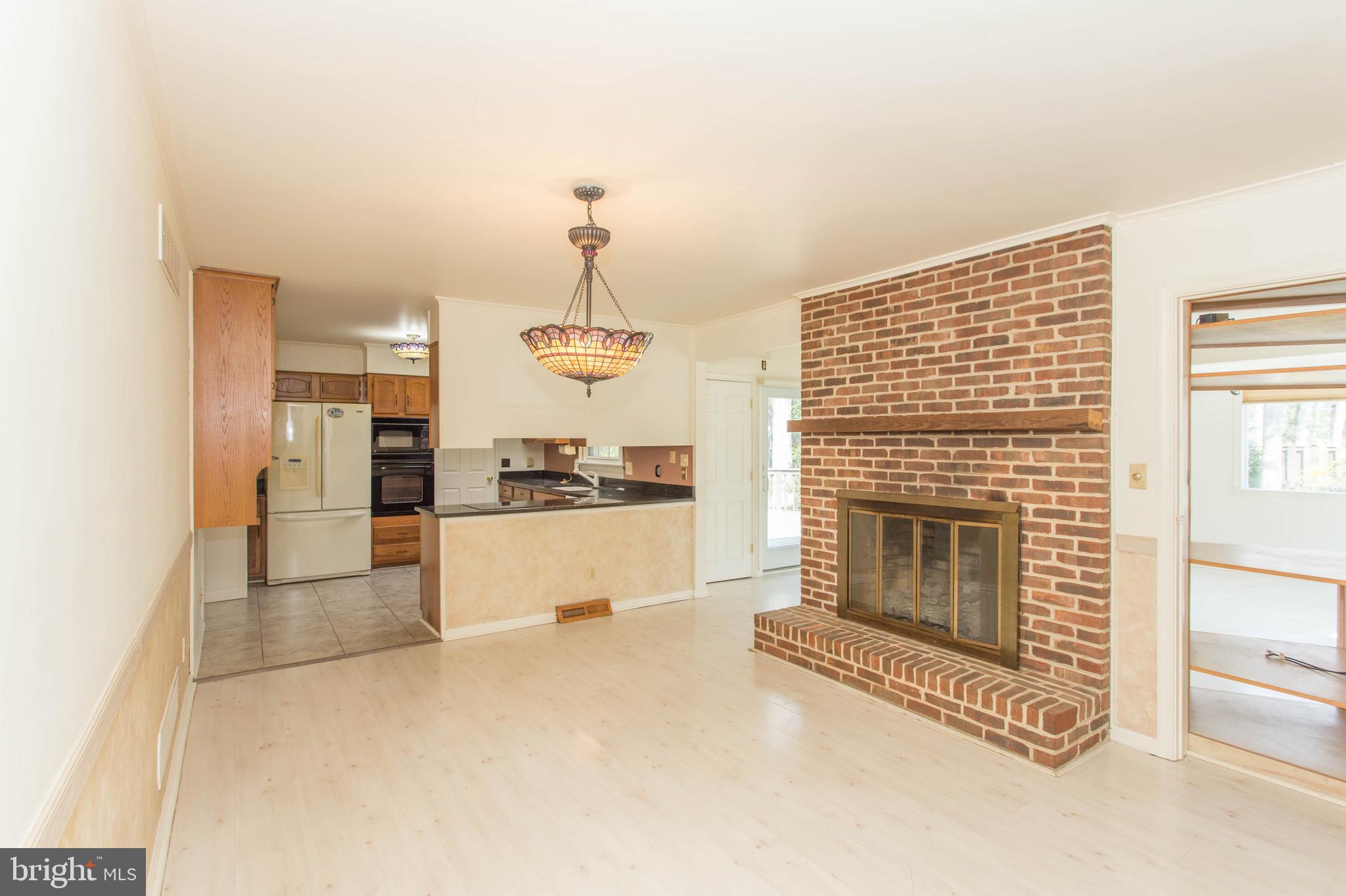 17 Kingsbridge Road Rehoboth Beach, DE 19971 - Photo 3 of 24 Family Room/Breakfast Nook/Brick Fireplace