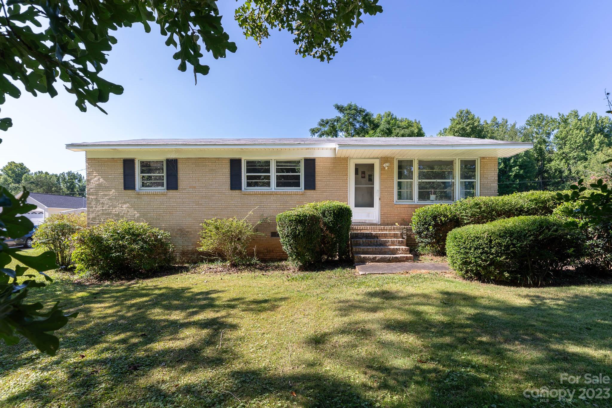 1494 Shiloh Unity Road Lancaster, SC 29720 - Photo 1 of 23 a view of a house with a yard and potted plants