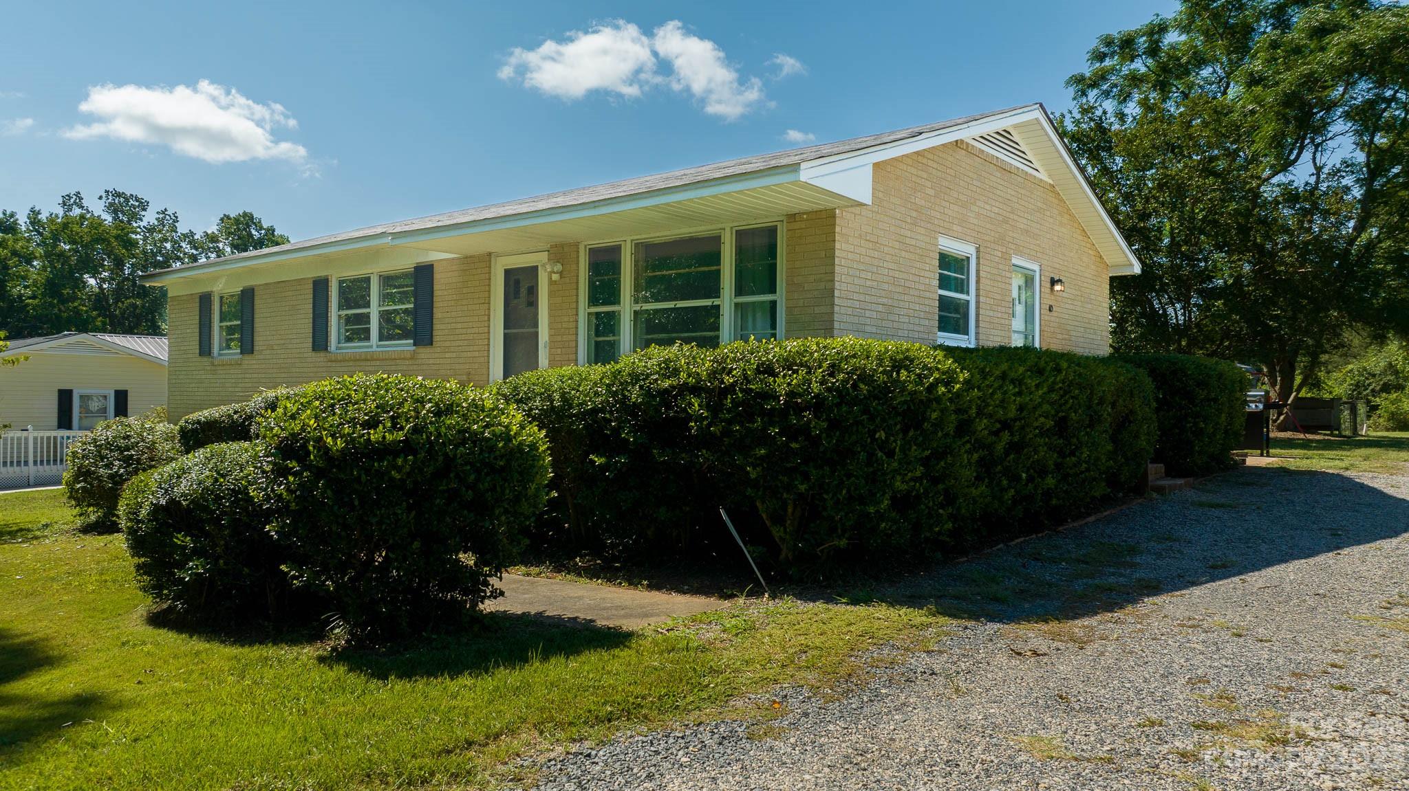 1494 Shiloh Unity Road Lancaster, SC 29720 - Photo 14 of 23 a view of a house with a garden
