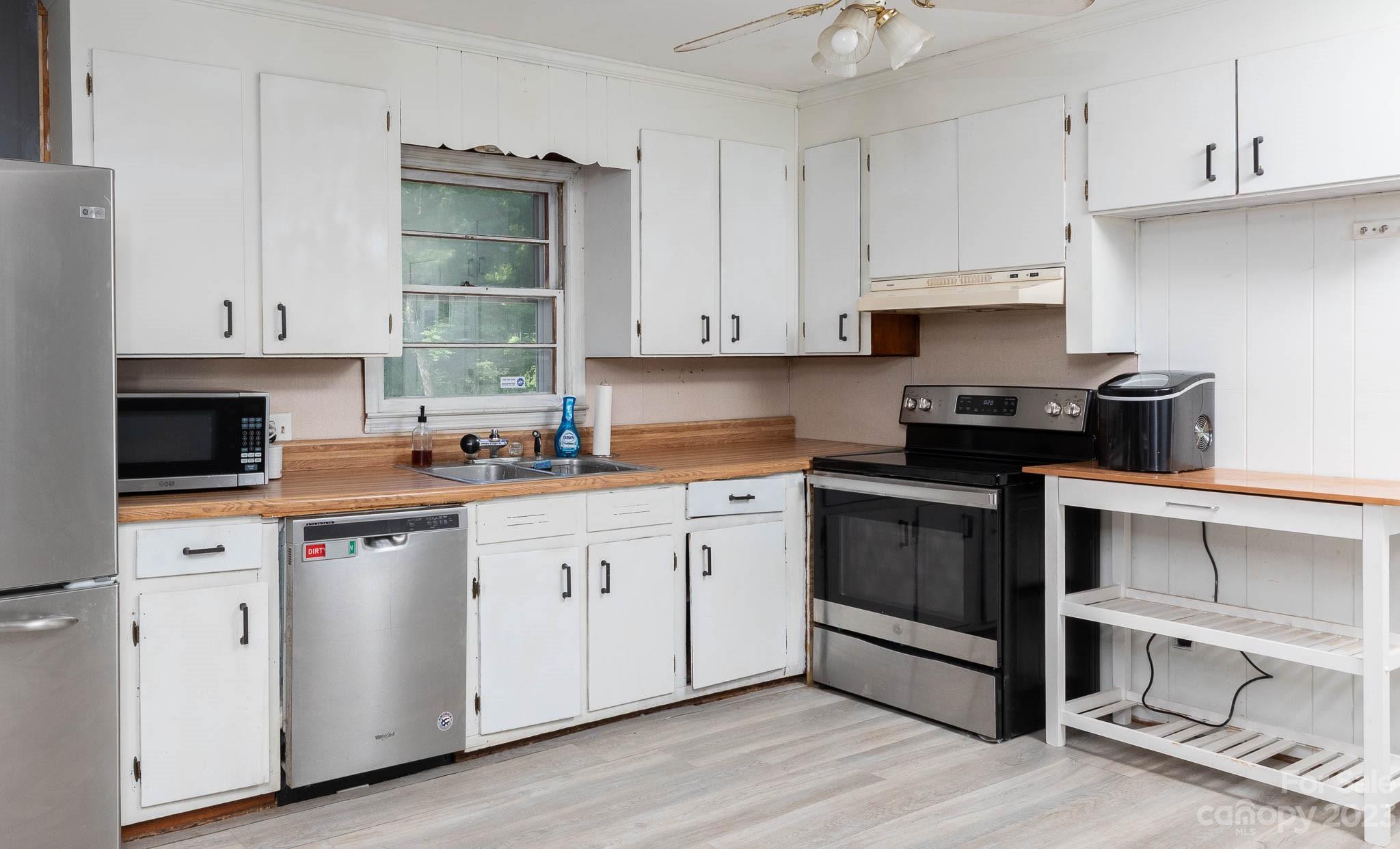 1494 Shiloh Unity Road Lancaster, SC 29720 - Photo 7 of 23 a kitchen with cabinets appliances and a sink