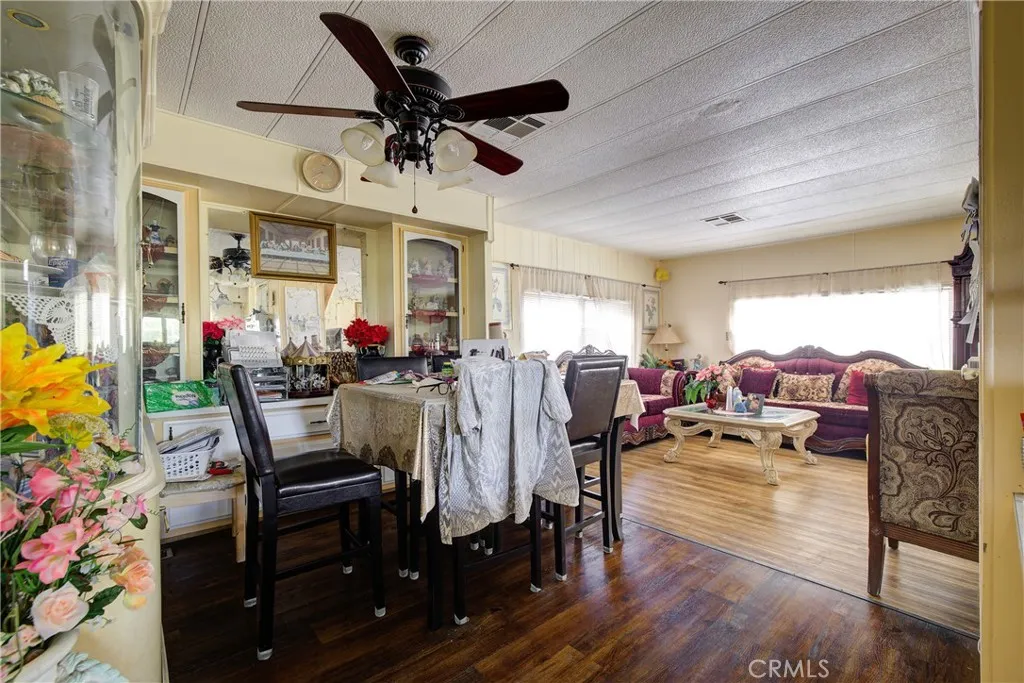 3700 Buchanan Street, Unit 180 Riverside, CA 92501 - Photo 12 of 23 a view of a dining room with furniture window and wooden floor