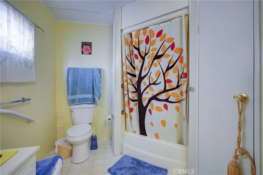 3700 Buchanan Street, Unit 180 Riverside, CA 92503 - Photo 19 of 23 a white toilet sitting next to a bathroom sink