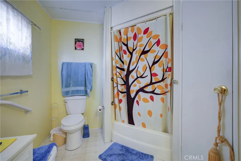 3700 Buchanan Street, Unit 180 Riverside, CA 92501 - Photo 19 of 23 a white toilet sitting next to a bathroom sink