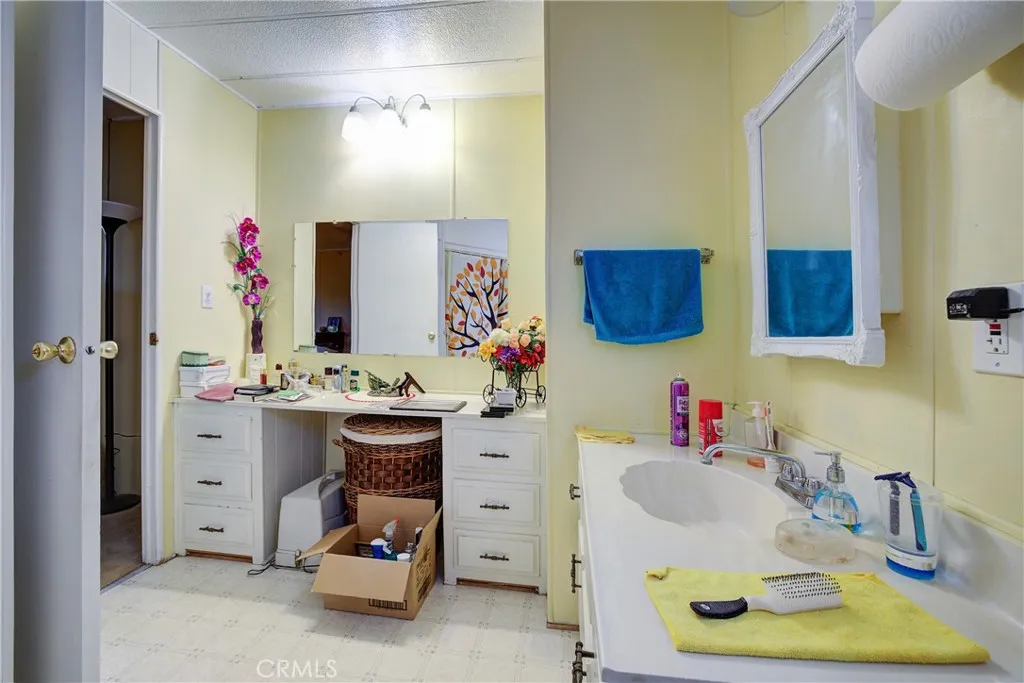 3700 Buchanan Street, Unit 180 Riverside, CA 92503 - Photo 20 of 23 a bathroom with a sink and a mirror