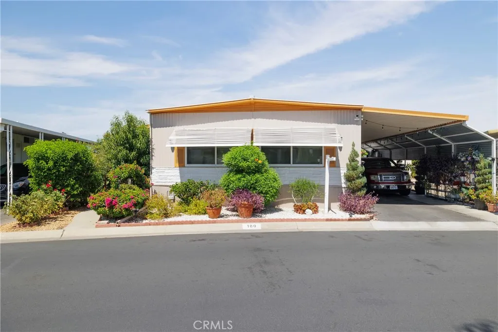 3700 Buchanan Street, Unit 180 Riverside, CA 92503 - Photo 2 of 23 front view of a house with a patio