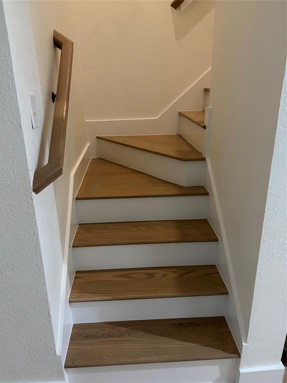 5550 Spring Valley Road, Unit E23 Dallas, TX 75254 - Photo 5 of 19 Stairs leading to primary suite.