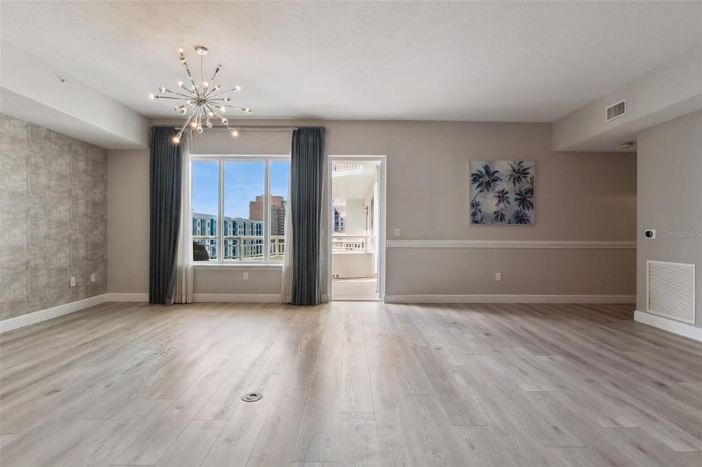 100 South Eola Drive, Unit 911 Orlando, FL 32801 - Photo 11 of 53 wooden floor in an empty room with a window