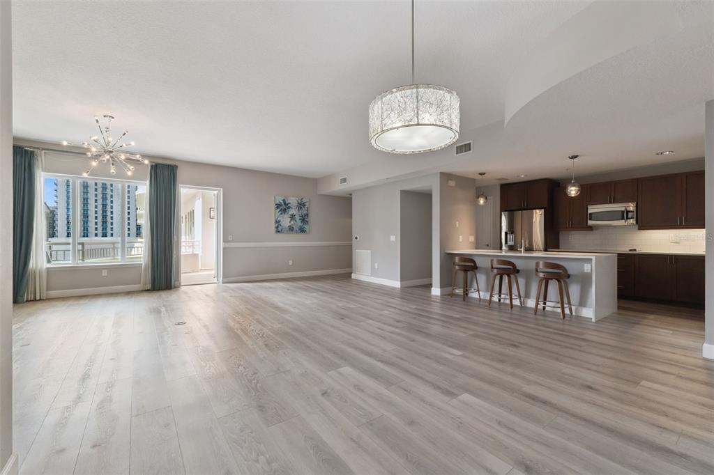 100 South Eola Drive, Unit 911 Orlando, FL 32801 - Photo 12 of 53 a view of a room with wooden floor and large windows