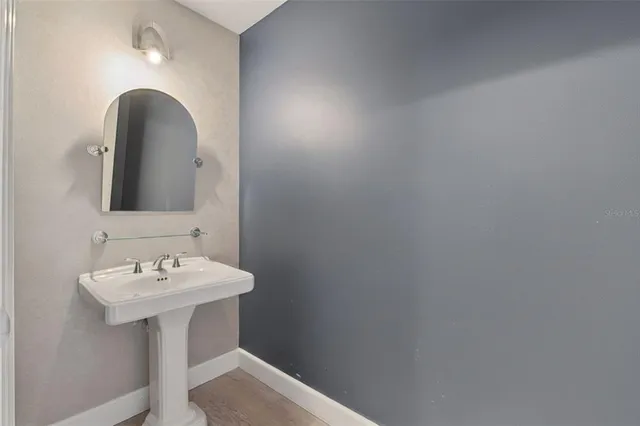 a kitchen with granite countertop a sink cabinets and stainless steel appliances