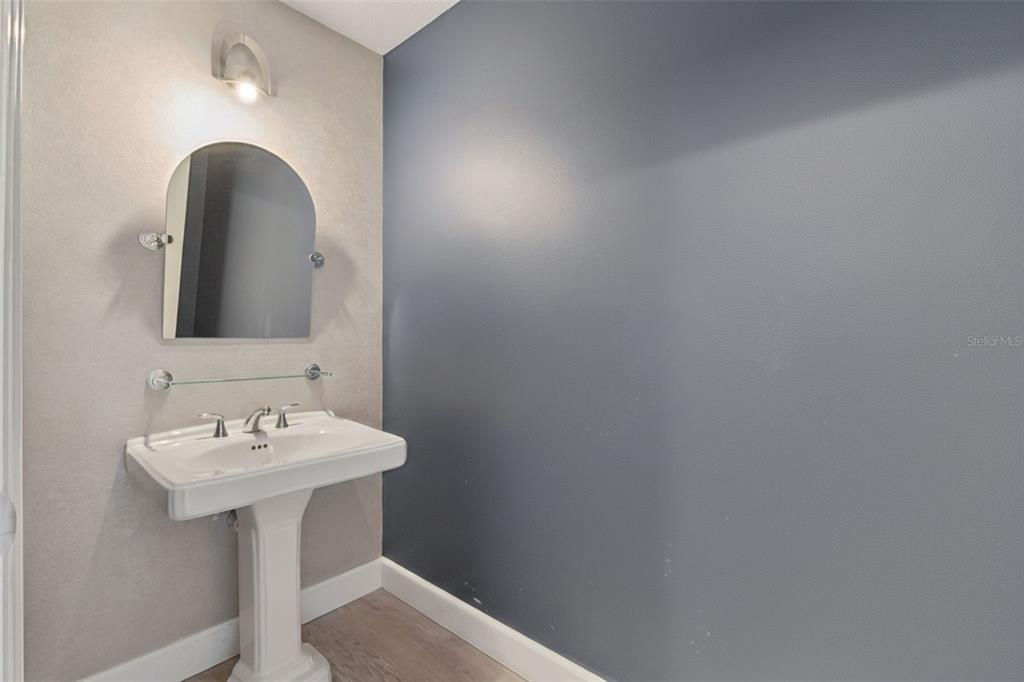 100 South Eola Drive, Unit 911 Orlando, FL 32801 - Photo 15 of 53 a bathroom with a sink and a mirror