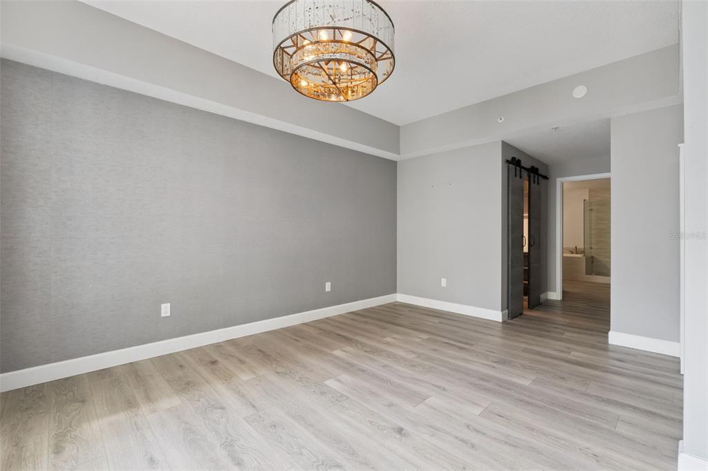 100 South Eola Drive, Unit 911 Orlando, FL 32801 - Photo 21 of 53 a view of an empty room with wooden floor