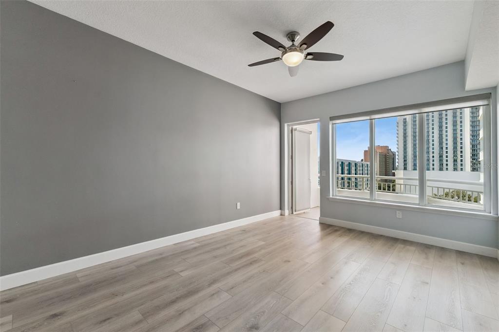 100 South Eola Drive, Unit 911 Orlando, FL 32801 - Photo 23 of 53 wooden floor in an empty room with a window