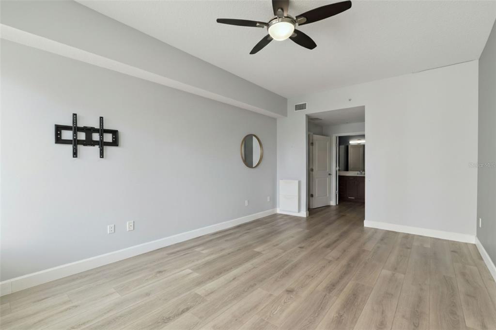 100 South Eola Drive, Unit 911 Orlando, FL 32801 - Photo 25 of 53 a view of an empty room with window and wooden floor