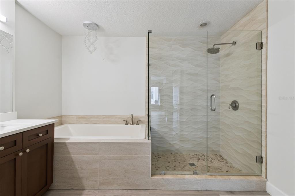 100 South Eola Drive, Unit 911 Orlando, FL 32801 - Photo 29 of 53 a bathroom with a bathtub and a shower