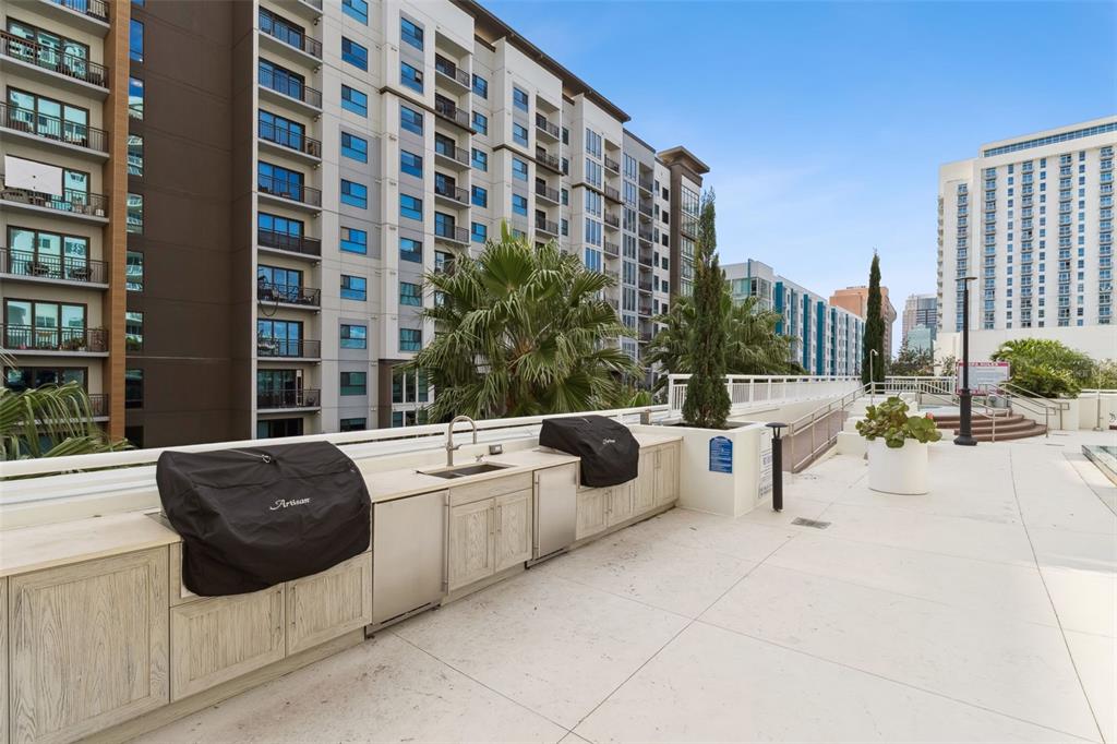 100 South Eola Drive, Unit 911 Orlando, FL 32801 - Photo 43 of 53 a roof deck with couches and potted plants