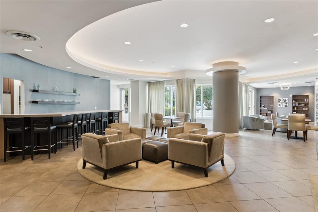 100 South Eola Drive, Unit 911 Orlando, FL 32801 - Photo 44 of 53 a living room with furniture and a flat screen tv