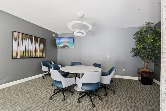 a kitchen with granite countertop a refrigerator and a sink