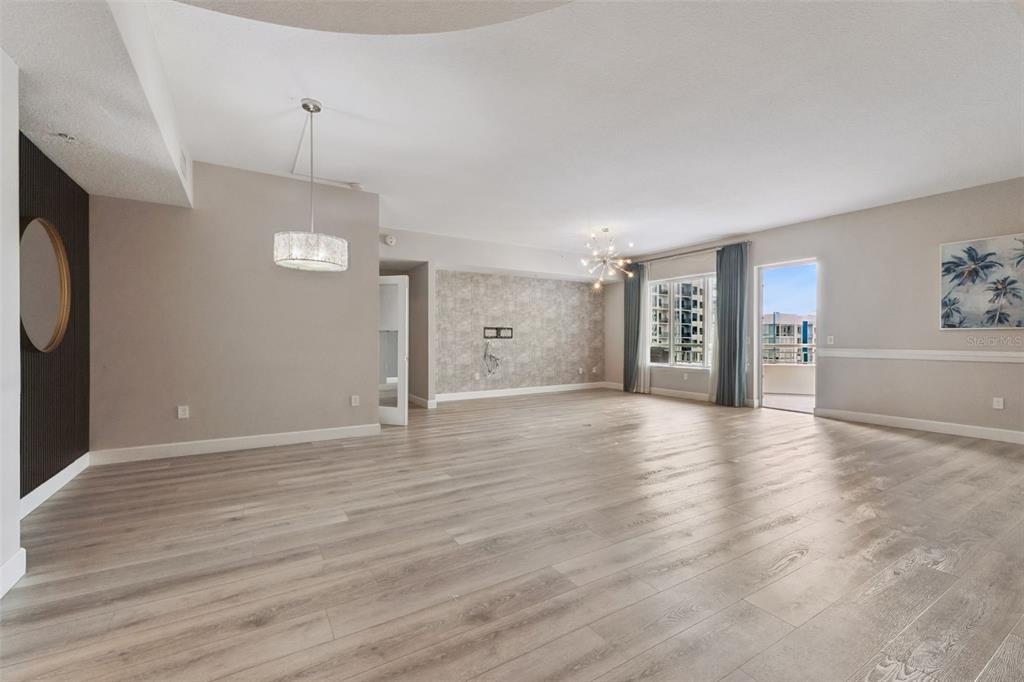 100 South Eola Drive, Unit 911 Orlando, FL 32801 - Photo 6 of 53 an empty room with wooden floor and window