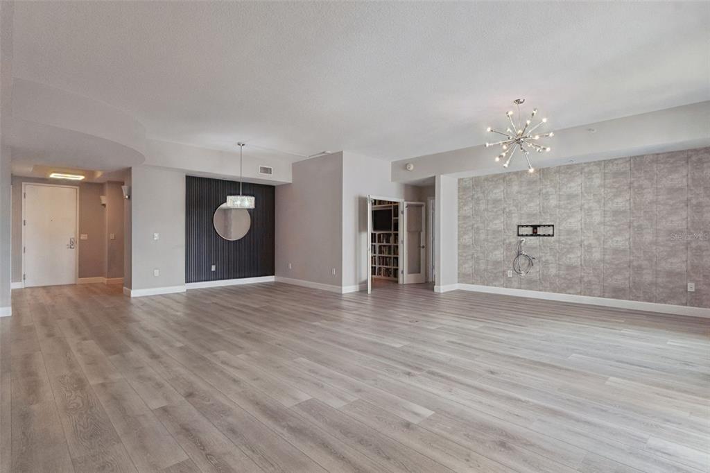 100 South Eola Drive, Unit 911 Orlando, FL 32801 - Photo 7 of 53 a view of an empty room with a window and wooden floor