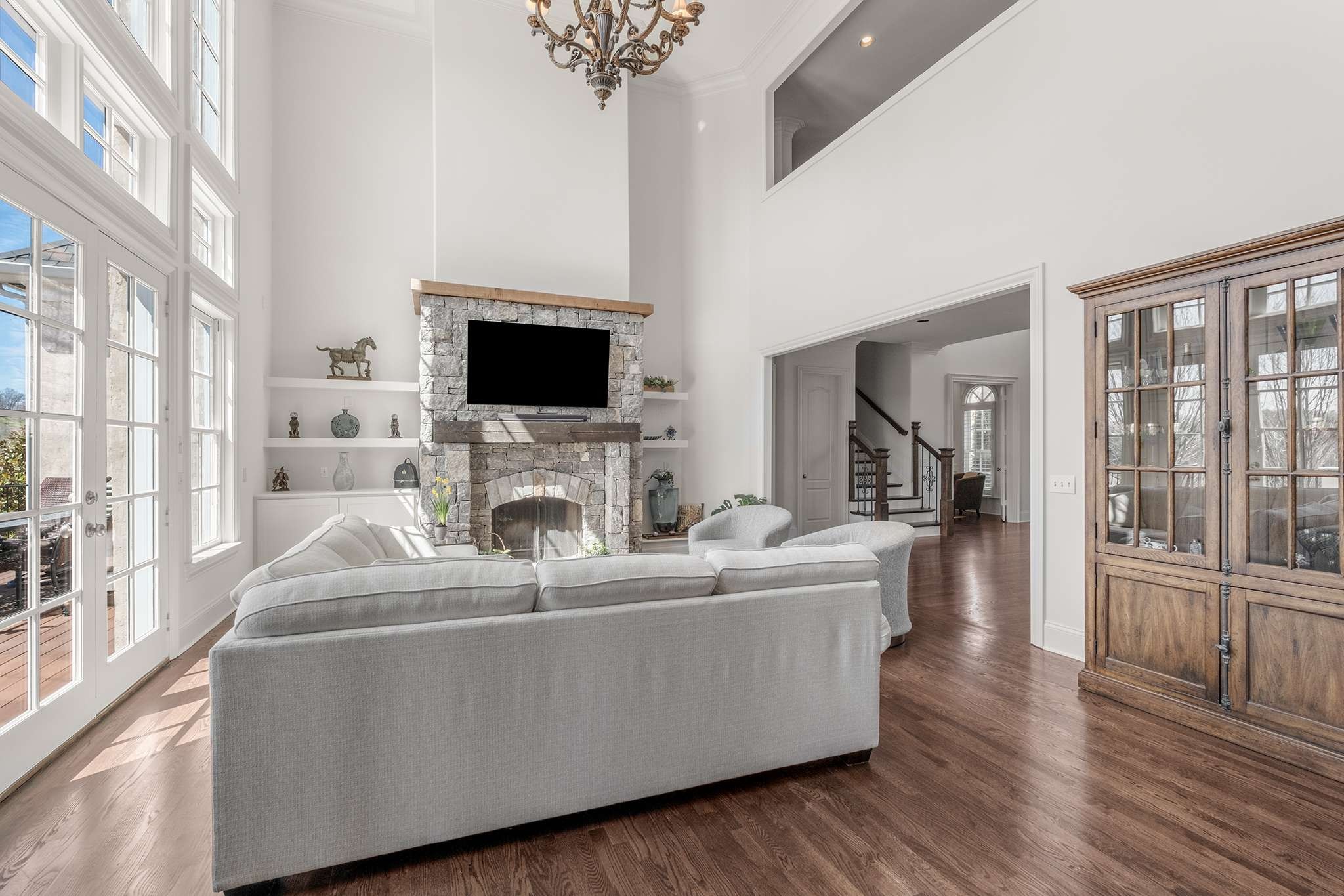 673 Legends Crest Drive Franklin, TN 37069 - Photo 15 of 81 a living room with furniture a flat screen tv and a fireplace
