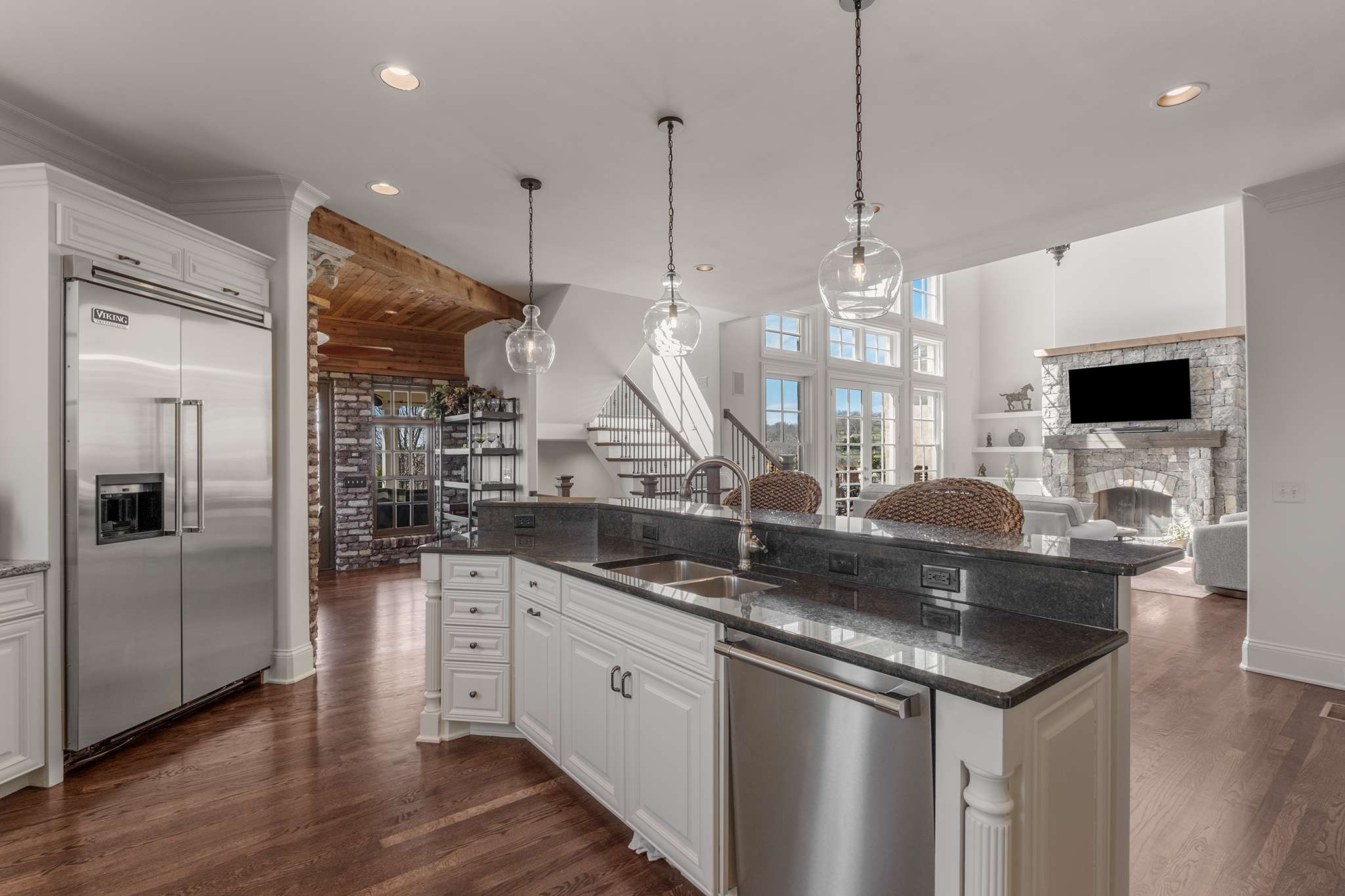 673 Legends Crest Drive Franklin, TN 37069 - Photo 21 of 81 a kitchen with stainless steel appliances granite countertop a sink a stove and a wooden floor