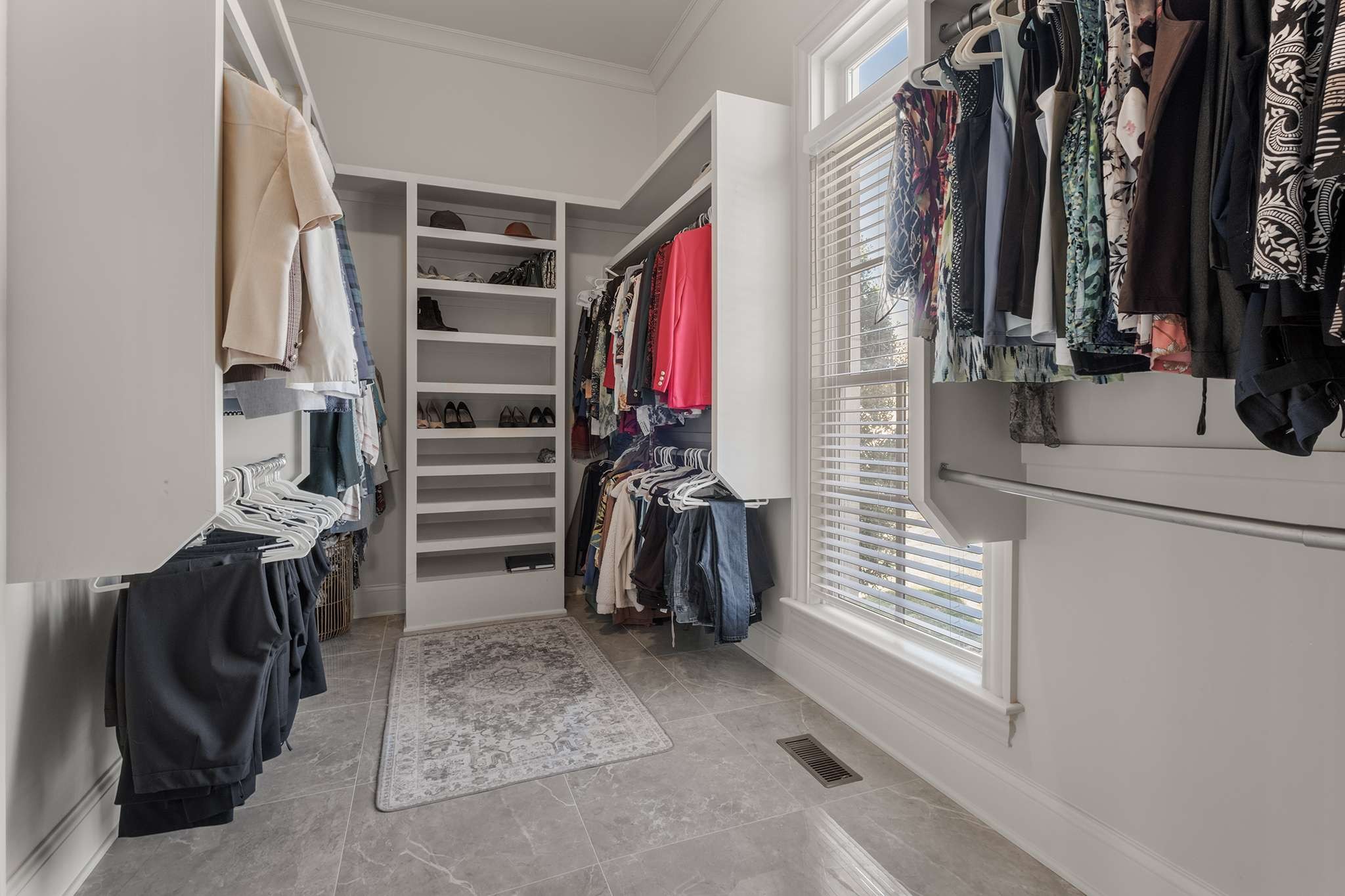 673 Legends Crest Drive Franklin, TN 37069 - Photo 33 of 81 a view of walk in closet with clothes and shoes