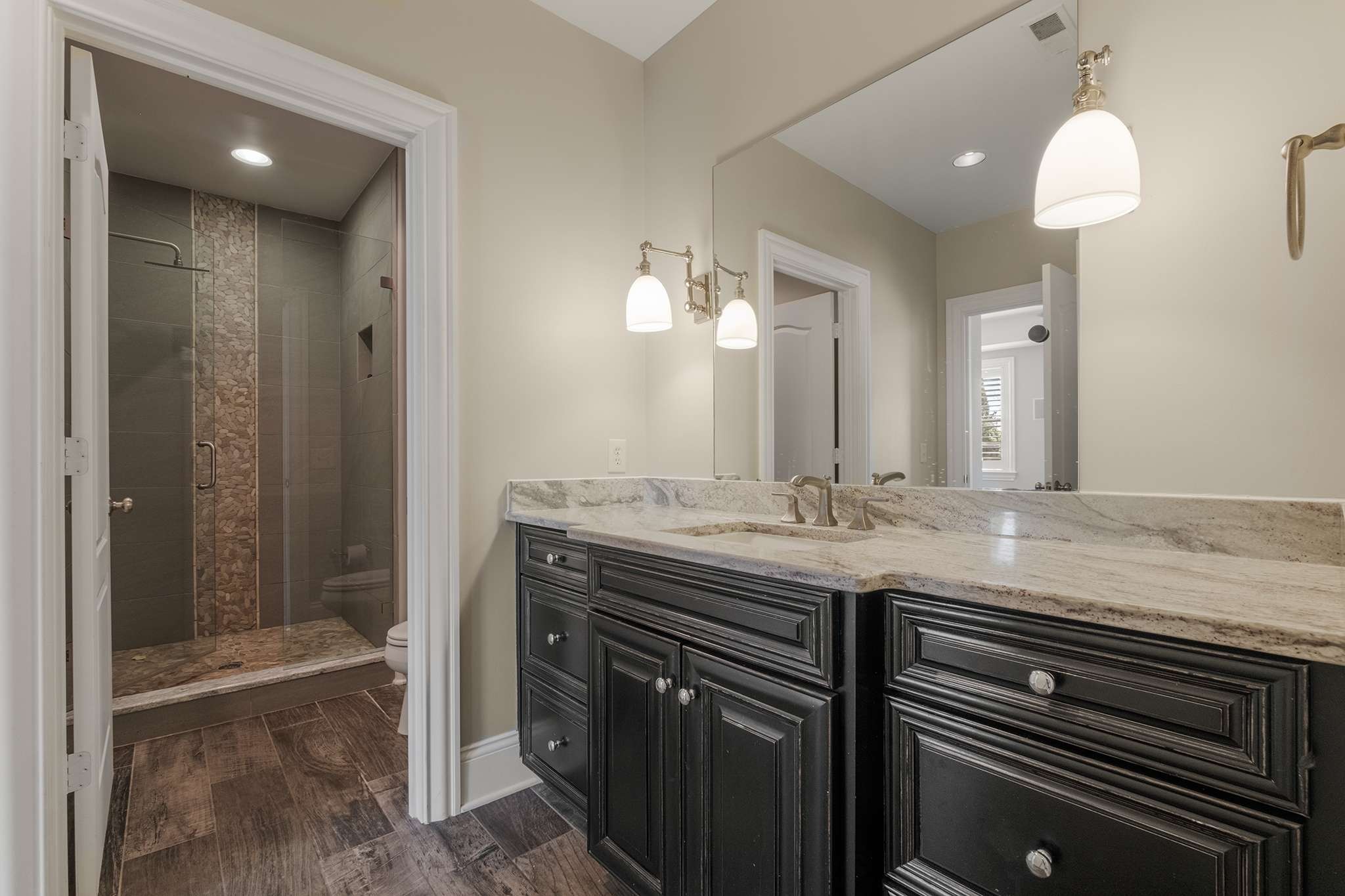 673 Legends Crest Drive Franklin, TN 37069 - Photo 59 of 81 a bathroom with a granite countertop sink and a mirror