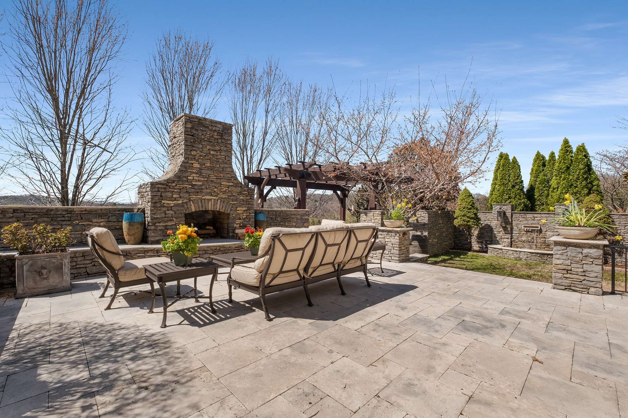 673 Legends Crest Drive Franklin, TN 37069 - Photo 69 of 81 a view of a patio with table and chairs and potted plants with wooden fence