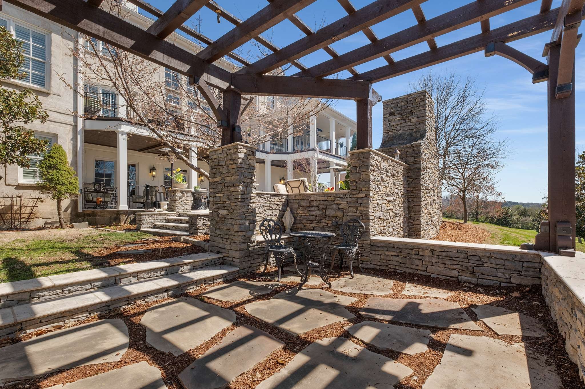 673 Legends Crest Drive Franklin, TN 37069 - Photo 75 of 81 a view of a patio with table and chairs and wooden floor