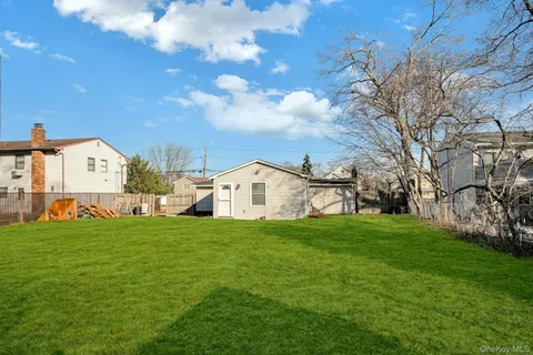 a view of a house with a big yard