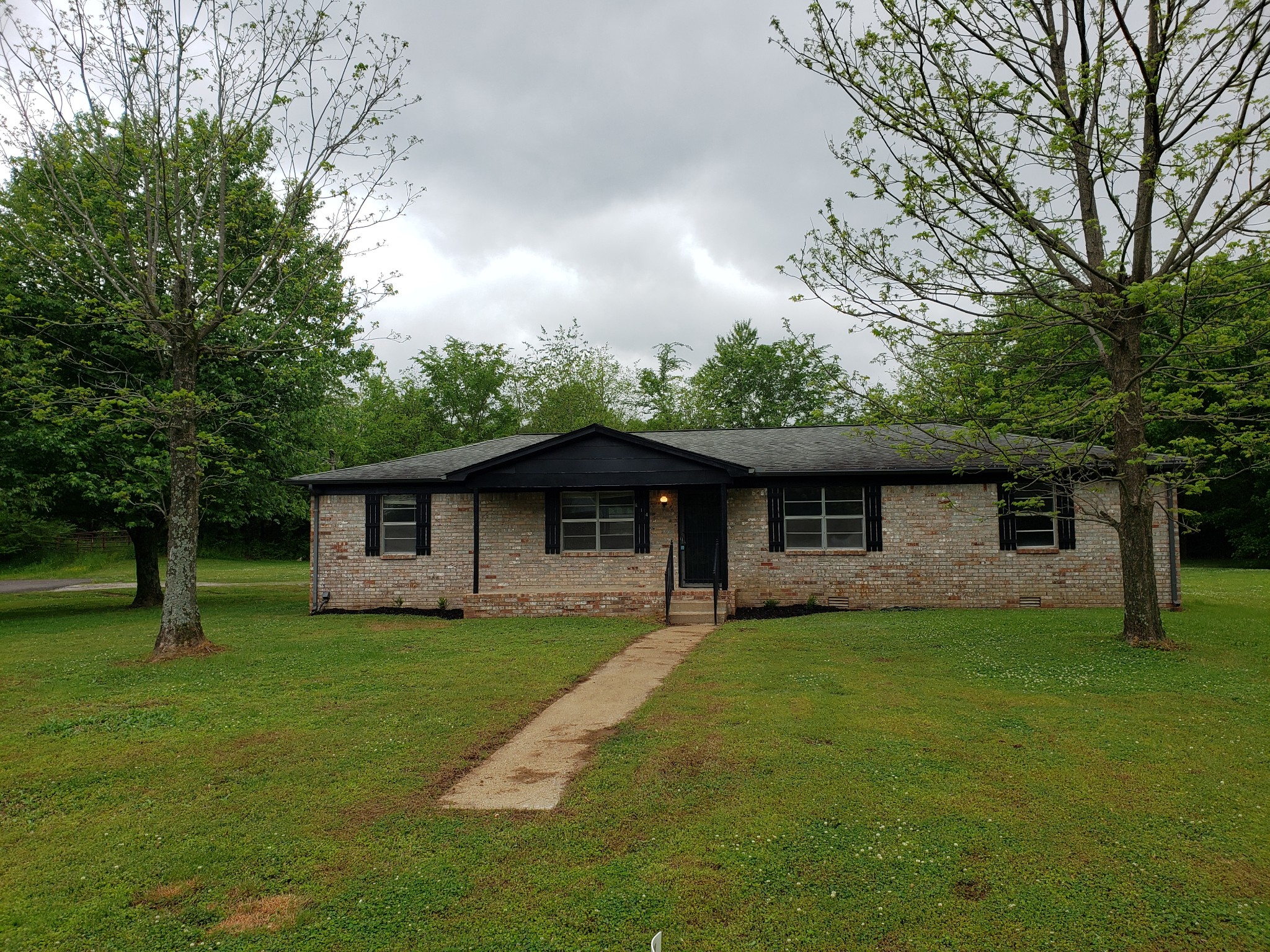 814 Miles Road Pulaski, TN 38478 - Photo 1 of 35 a view of a house with a yard