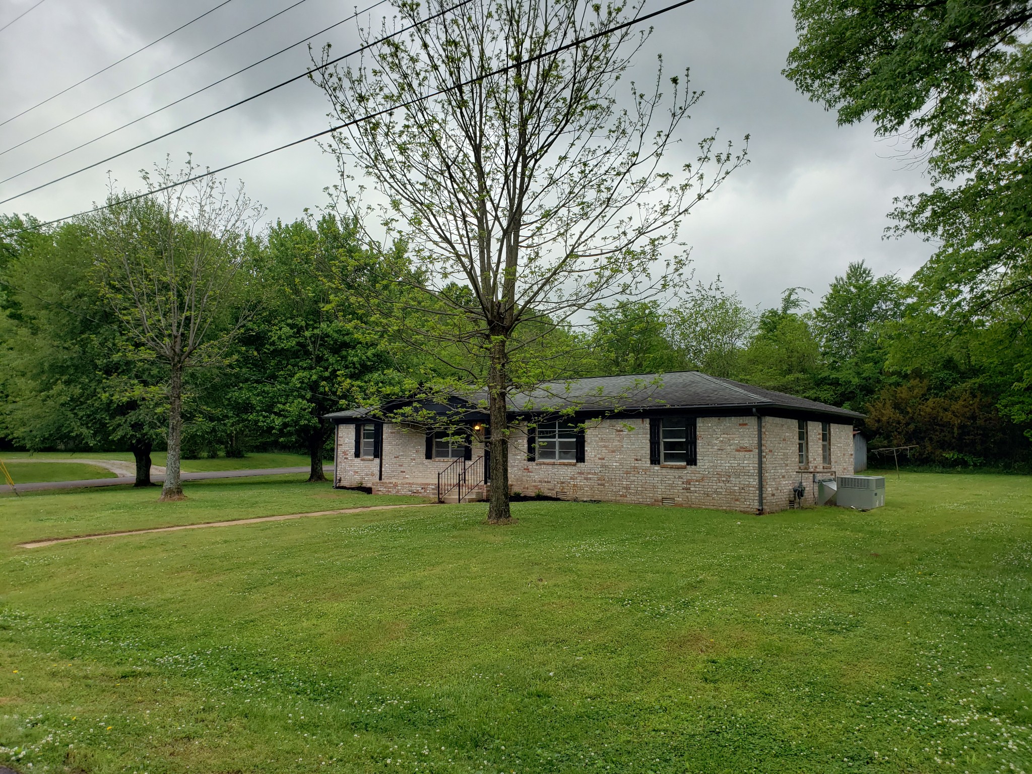 814 Miles Road Pulaski, TN 38478 - Photo 3 of 35 a view of a house with a big yard