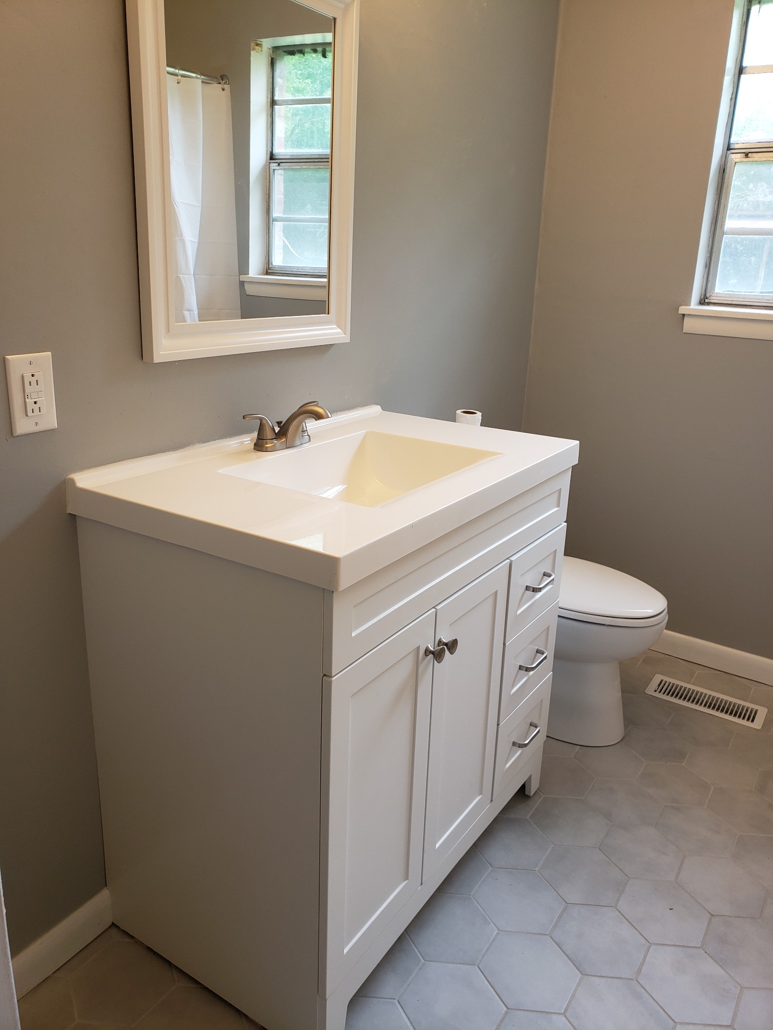 814 Miles Road Pulaski, TN 38478 - Photo 21 of 35 a bathroom with a toilet sink and mirror