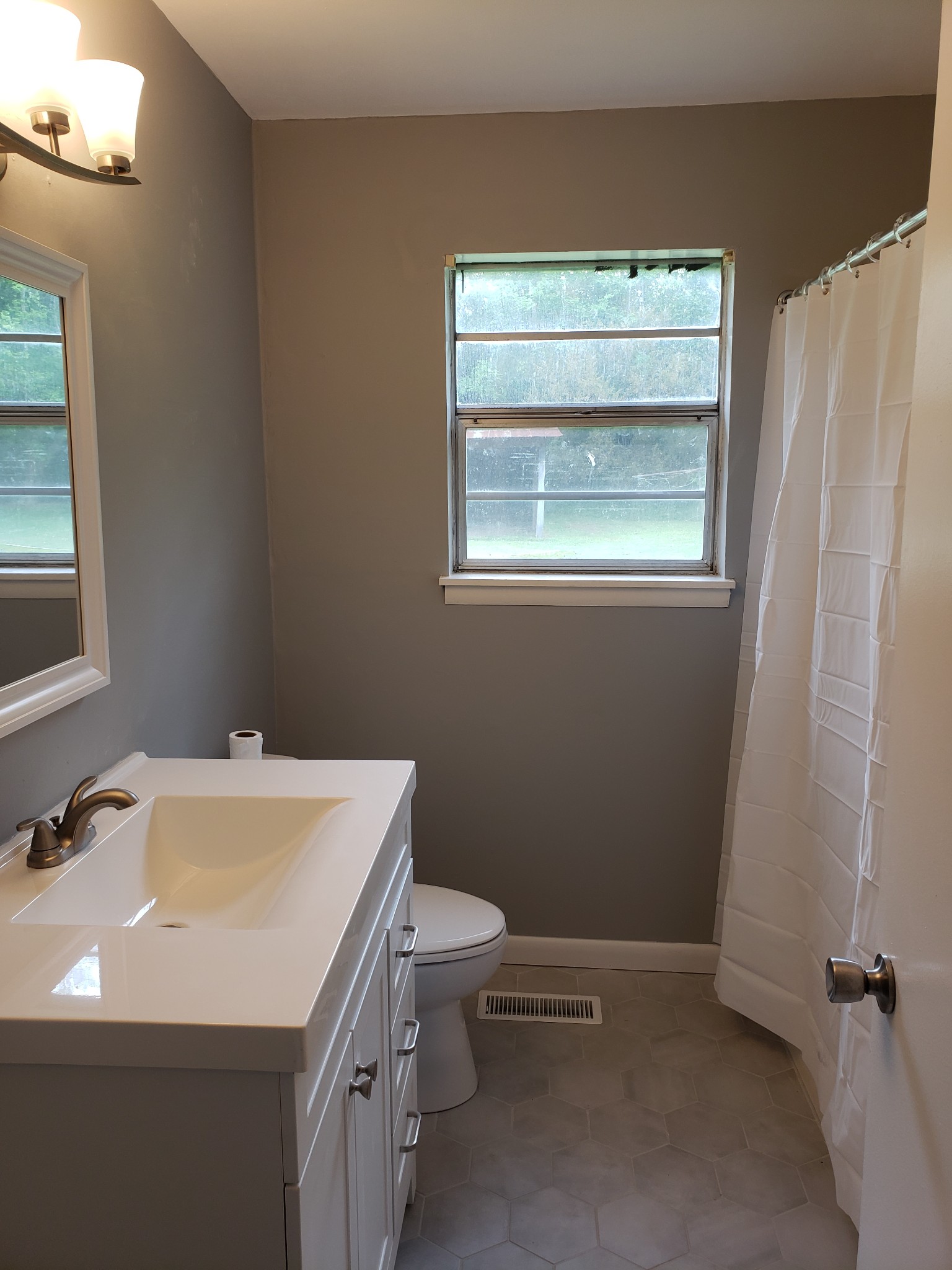 814 Miles Road Pulaski, TN 38478 - Photo 22 of 35 a bathroom with a sink a toilet and a window