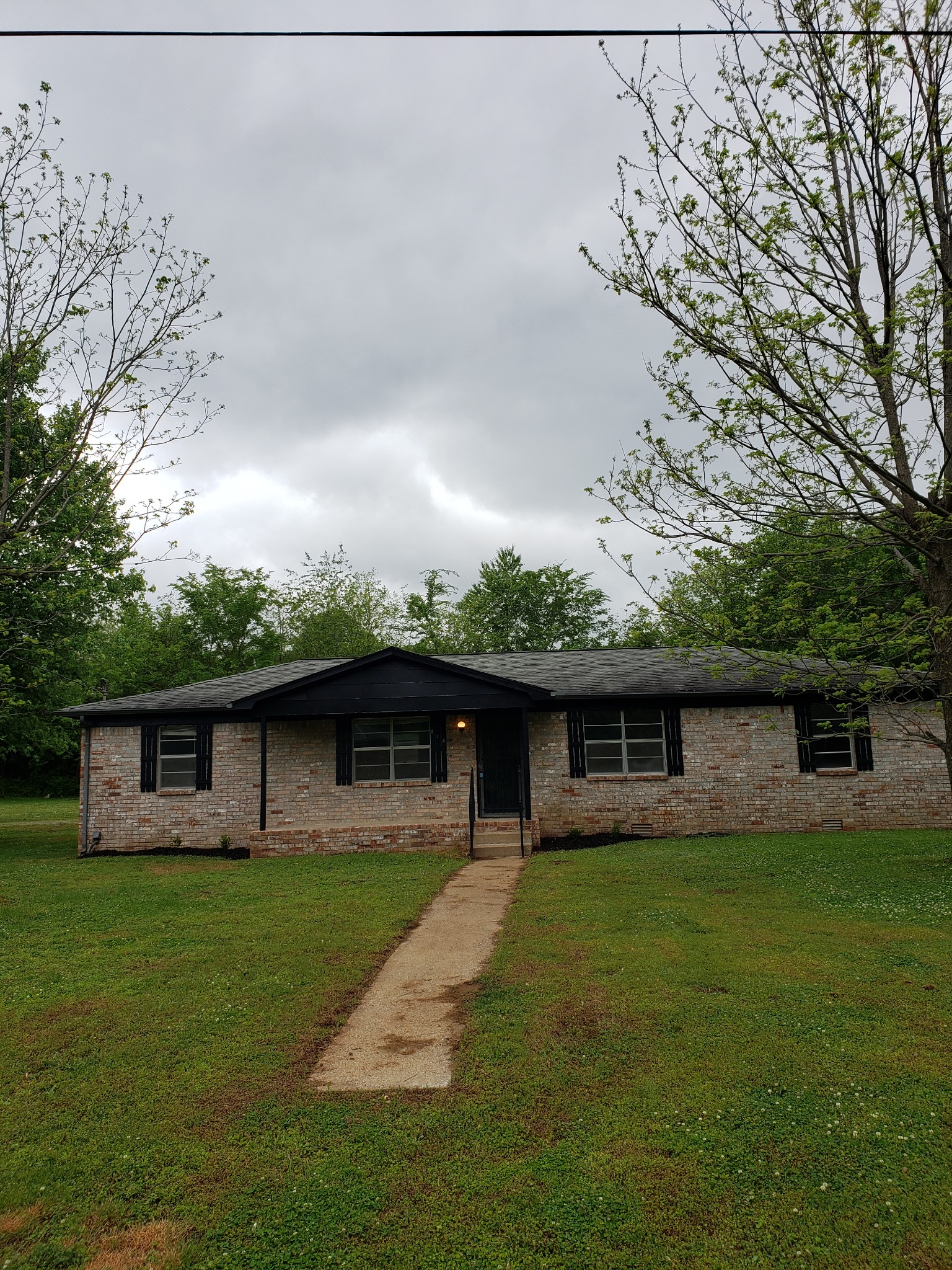 814 Miles Road Pulaski, TN 38478 - Photo 4 of 35 a front view of house with yard patio and green space