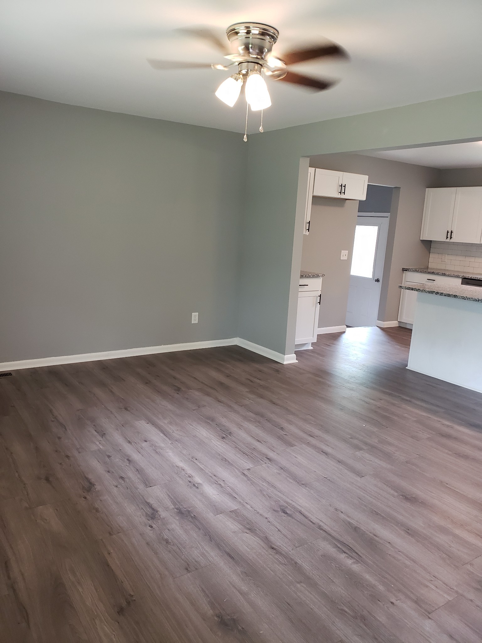 814 Miles Road Pulaski, TN 38478 - Photo 8 of 35 wooden floor in an empty room with a window