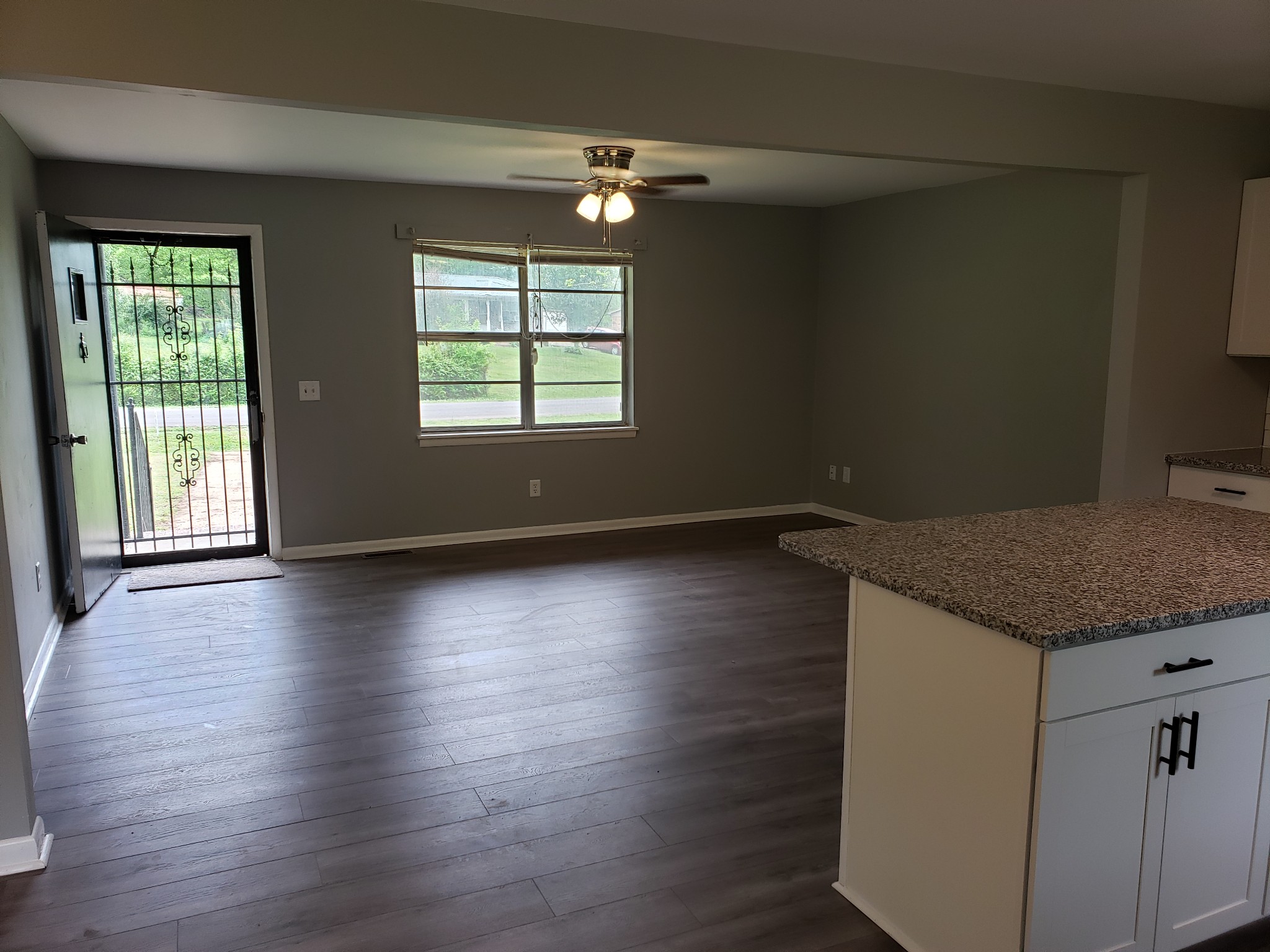 814 Miles Road Pulaski, TN 38478 - Photo 9 of 35 an empty room with wooden floor and windows