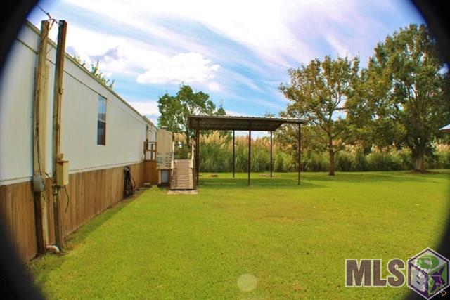 982-983 Aragon Road Montegut, LA 70377 - Photo 12 of 45 Rear Carport/Boat Parking area