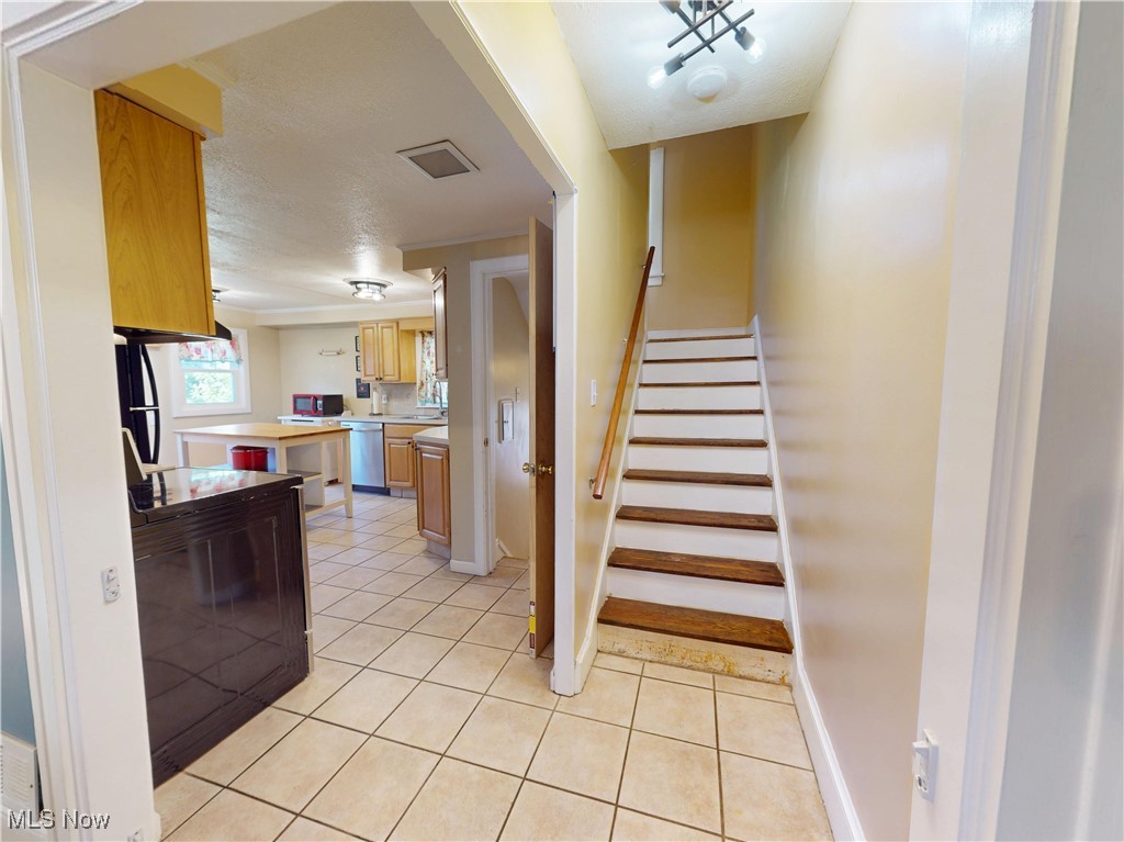 1136 Erieview Road Cleveland Heights, OH 44121 - Photo 14 of 45 Stairway featuring tile patterned floors