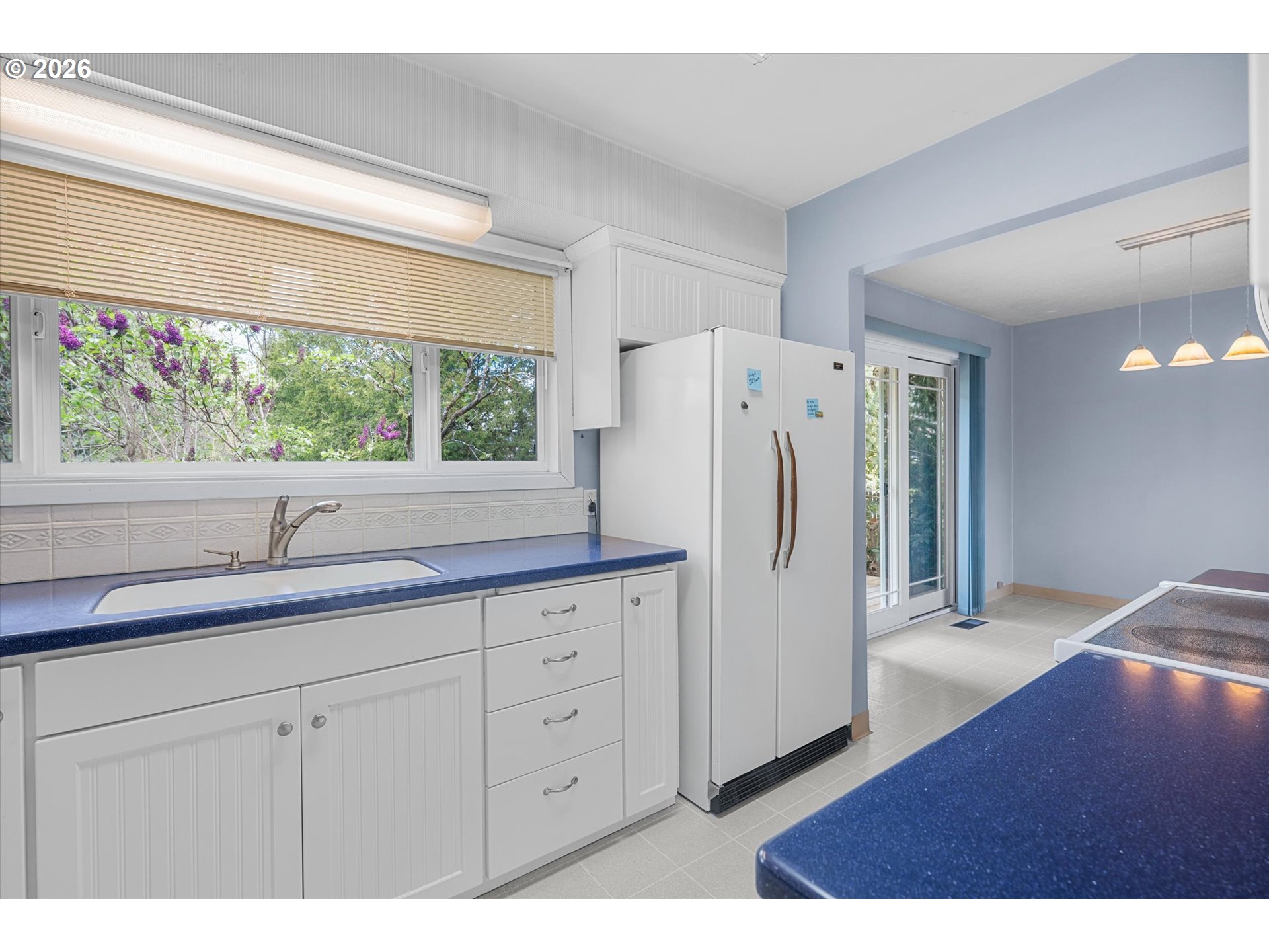 3235 Southeast Silver Springs Road Milwaukie, OR 97222 - Photo 12 of 32 a kitchen with a refrigerator and a sink
