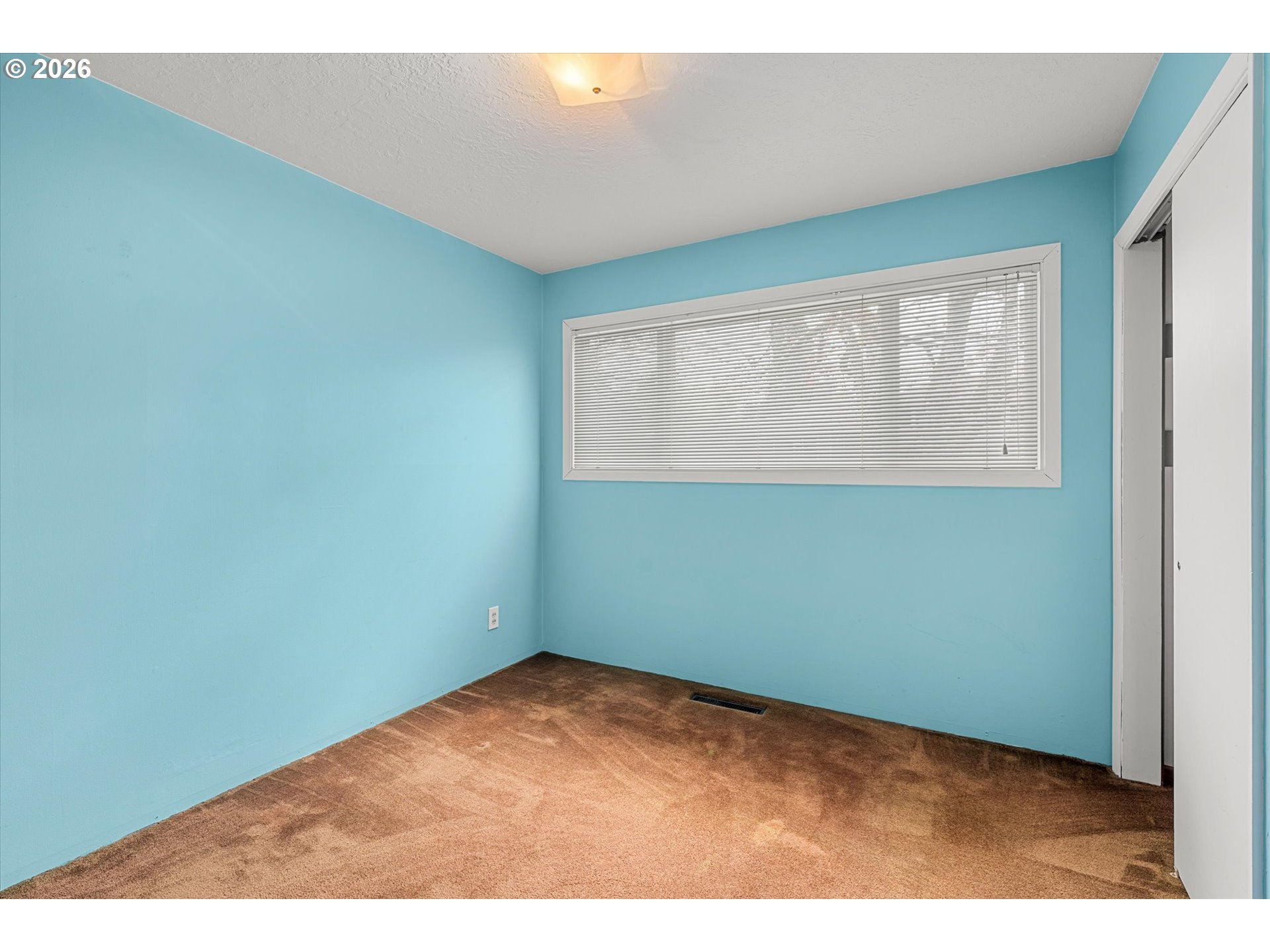 3235 Southeast Silver Springs Road Milwaukie, OR 97222 - Photo 18 of 32 a view of an empty room with a window