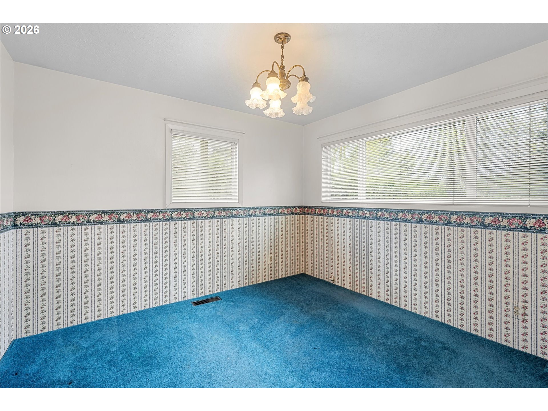 3235 Southeast Silver Springs Road Milwaukie, OR 97222 - Photo 19 of 32 a view of wooden floor and chandelier