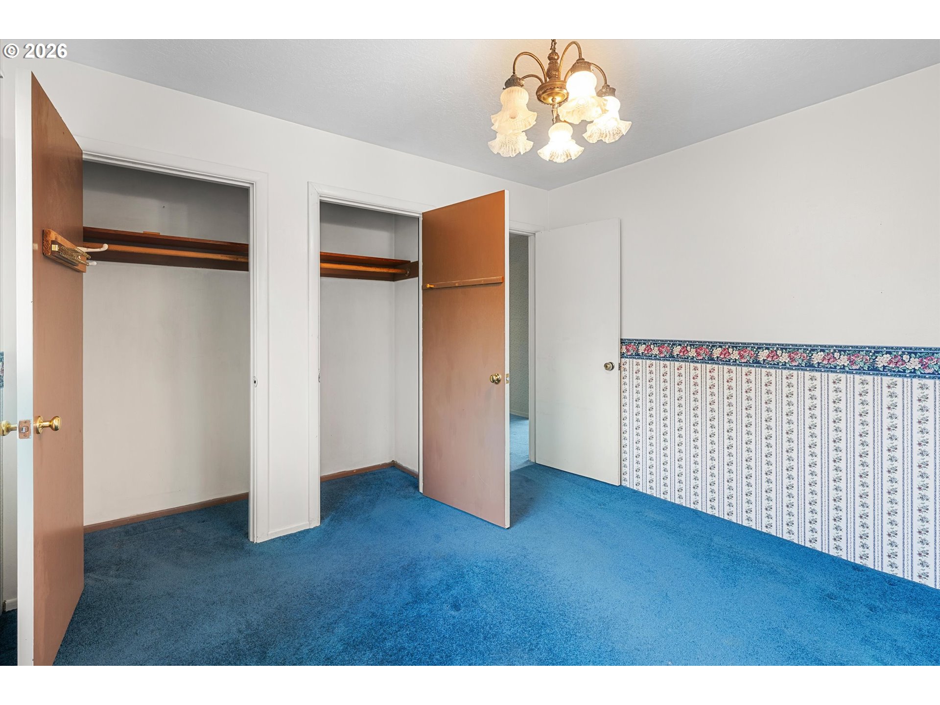 3235 Southeast Silver Springs Road Milwaukie, OR 97222 - Photo 20 of 32 a view of an empty room with wooden floor and a window