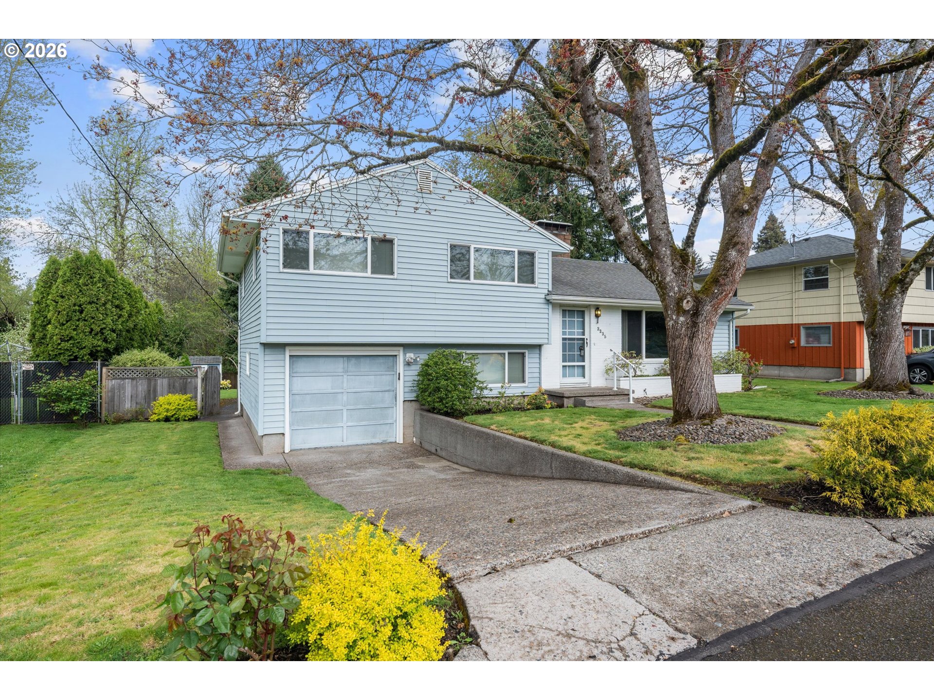 3235 Southeast Silver Springs Road Milwaukie, OR 97222 - Photo 2 of 32 a front view of a house with a yard