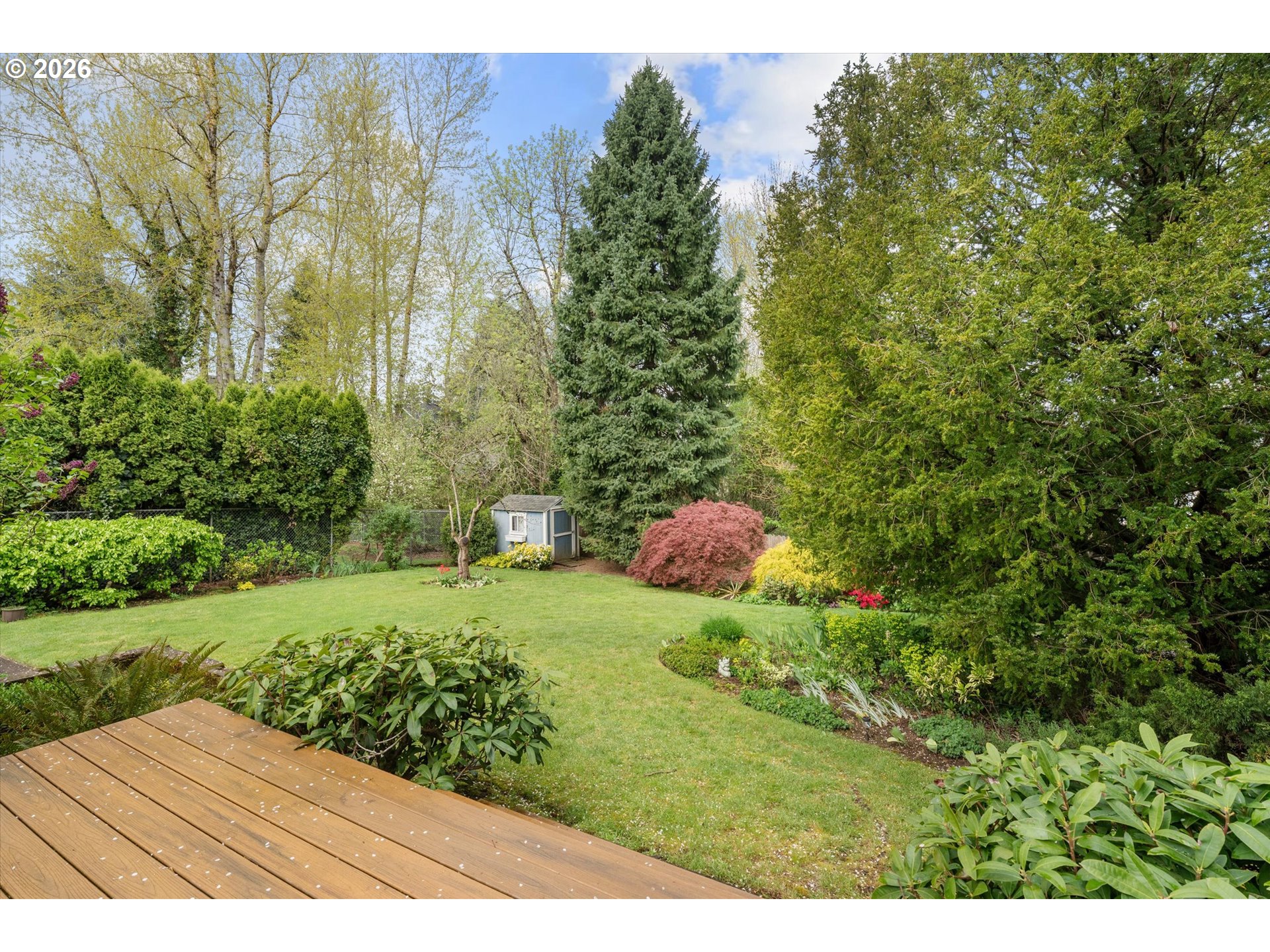 3235 Southeast Silver Springs Road Milwaukie, OR 97222 - Photo 32 of 32 a view of a wooden fence and some plants