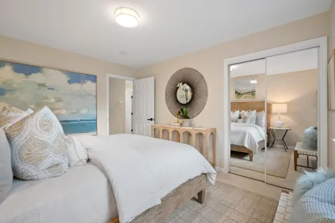 a bed room with two beds and a window